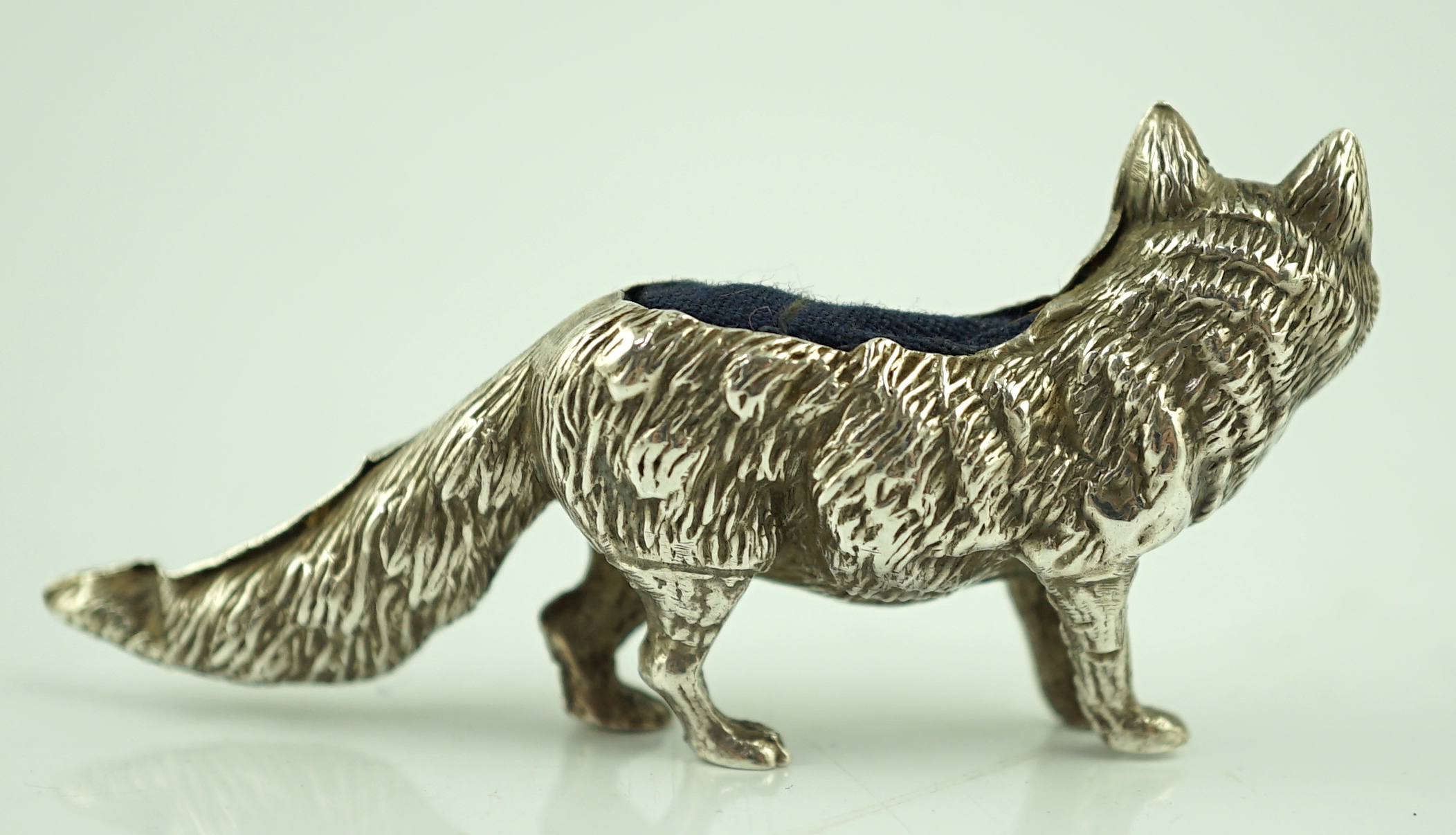 An Edwardian novelty silver pin cushion, modelled as a fox, Levi & Salaman